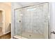 Shower featuring glass enclosure, a window, tile walls, and a showerhead at 1803 Jackson St, Fortville, IN 46040