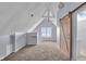 Attic space with carpet, lighting, and views of the neighborhood at 1854 Applegate St, Indianapolis, IN 46203