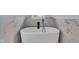 Bright bathroom featuring a modern white tub, stylish marble wall tile, and a sleek faucet at 1854 Applegate St, Indianapolis, IN 46203