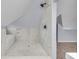 Beautifully designed bathroom with a modern shower and tile accents, featuring a connecting attic space at 1854 Applegate St, Indianapolis, IN 46203