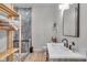 Bathroom boasts a modern vanity, mirror, and walk in shower at 1854 Applegate St, Indianapolis, IN 46203