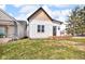 Charming home featuring vertical siding, cedar shake roof accent, and a compact front porch at 1854 Applegate St, Indianapolis, IN 46203