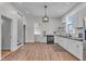 Open-concept kitchen features stainless appliances, wooden countertops, and modern lighting at 1854 Applegate St, Indianapolis, IN 46203