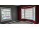A bedroom showcasing a window and bay window, offering natural light and neighborhood views at 2028 George St, Anderson, IN 46016