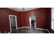 Cozy living space featuring wood floors and unique architectural arches at 2028 George St, Anderson, IN 46016