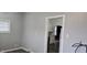 Another room showing a window and access to the kitchen at 2028 George St, Anderson, IN 46016