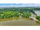 Impressive aerial view of lakefront home featuring large docks and a boat lift at 22 Point Ln, Arcadia, IN 46030