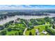 An aerial view showcases lakefront living with mature trees and lush greenery surrounding the property at 22 Point Ln, Arcadia, IN 46030