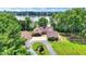 Aerial view of a charming home with well-manicured lawn, mature trees and lake views at 22 Point Ln, Arcadia, IN 46030