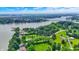 Scenic aerial view of lakefront property with lush green landscaping and waterfront access at 22 Point Ln, Arcadia, IN 46030