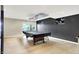 View of a basement with a pool table and a sliding glass door to the outside at 22 Point Ln, Arcadia, IN 46030
