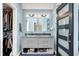 Updated bathroom with double vanity, modern lighting, and barn door entry at 22 Point Ln, Arcadia, IN 46030