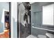 Sleek, updated walk-in shower with rain shower head and dark tile at 22 Point Ln, Arcadia, IN 46030