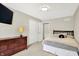 Cozy bedroom with neutral walls, carpet, dresser, closet, and a comfortable queen-sized bed at 22 Point Ln, Arcadia, IN 46030