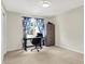Bedroom with a desk, chair, carpet, blue curtains, and a dresser, creating an ideal workspace at 22 Point Ln, Arcadia, IN 46030