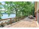 Wooden deck offers serene lake views and access to lush greenery at 22 Point Ln, Arcadia, IN 46030