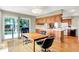 Eat-in kitchen with wood floors, sliding doors to lake, and warm cabinets at 22 Point Ln, Arcadia, IN 46030