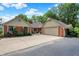 Beautiful single-story brick house with a large driveway, mature trees, and attached garage at 22 Point Ln, Arcadia, IN 46030