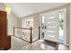 Inviting foyer with a bright front door, lovely staircase, and warm tile flooring at 22 Point Ln, Arcadia, IN 46030