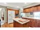 Kitchen with stainless steel appliances, island and wood cabinets at 22 Point Ln, Arcadia, IN 46030