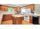 Charming kitchen featuring wood cabinets, hardwood floors, and modern appliances at 22 Point Ln, Arcadia, IN 46030