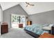 Spacious main bedroom featuring a ceiling fan, vaulted ceiling, and access to a private balcony at 22 Point Ln, Arcadia, IN 46030