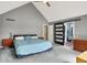 Main bedroom with ceiling fan and sliding barn door access to en-suite bathroom at 22 Point Ln, Arcadia, IN 46030