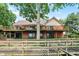 Expansive brick home featuring a wrap-around deck, walkout basement, and wooden walkway to the water at 22 Point Ln, Arcadia, IN 46030