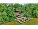 Serene lakefront home featuring a multi-level deck and multiple docks for waterfront enjoyment at 22 Point Ln, Arcadia, IN 46030