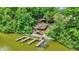 Beautiful lakefront home featuring a large wooden deck and multiple docks at 22 Point Ln, Arcadia, IN 46030
