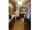 Galley kitchen with brown wood cabinets and a peek into the dining room at 2522 S Randolph St, Indianapolis, IN 46203