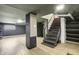 Unfinished basement area with stairs, and ample space for storage or recreation at 2702 N Talbott St, Indianapolis, IN 46205