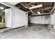 Unfinished basement with painted walls and floor, and exposed ceiling at 2702 N Talbott St, Indianapolis, IN 46205