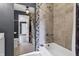 Bathroom featuring decorative tile, bathtub and a large mirror at 2702 N Talbott St, Indianapolis, IN 46205
