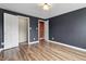 Spacious bedroom featuring hardwood floors and a walk-in closet at 2702 N Talbott St, Indianapolis, IN 46205
