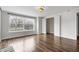 Bright bedroom featuring hardwood floors, a large window, and a closet at 2702 N Talbott St, Indianapolis, IN 46205
