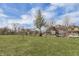 Grassy front yard with trees and a view of the neighborhood at 2702 N Talbott St, Indianapolis, IN 46205