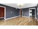 Spacious living room with wood floors, black walls, and elegant lighting at 2702 N Talbott St, Indianapolis, IN 46205