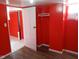 Spacious room with red walls, white trim and light hardwood flooring at 3035 Graceland Ave, Indianapolis, IN 46208