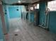 Spacious basement with tile flooring and water heater installation in a single Gathering home at 3035 Graceland Ave, Indianapolis, IN 46208