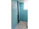 The water heater inside the blue walled basement with tiled floors at 3035 Graceland Ave, Indianapolis, IN 46208