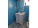 Bathroom vanity with sink, mirror and blue wall at 3035 Graceland Ave, Indianapolis, IN 46208