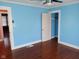 Corner view of bedroom with hardwood floors, ceiling fan, and closet at 3035 Graceland Ave, Indianapolis, IN 46208