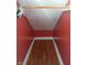 Walk-in closet with upper rod and wood flooring at 3035 Graceland Ave, Indianapolis, IN 46208