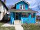 Charming blue two-story home featuring a welcoming front porch and well-maintained exterior at 3035 Graceland Ave, Indianapolis, IN 46208