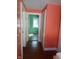 Hallway with wood floors and doorways leading to other rooms at 3035 Graceland Ave, Indianapolis, IN 46208