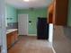 Bright kitchen with updated backsplash, cabinets, and a modern refrigerator at 3035 Graceland Ave, Indianapolis, IN 46208