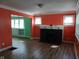 Cozy living room featuring fireplace, hardwood floors, and plenty of natural light at 3035 Graceland Ave, Indianapolis, IN 46208