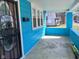 Covered porch area featuring light blue siding and ample space, perfect for relaxing outdoors at 3035 Graceland Ave, Indianapolis, IN 46208