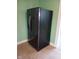 Modern black refrigerator with water and ice dispenser complementing the kitchen's sleek design at 3035 Graceland Ave, Indianapolis, IN 46208